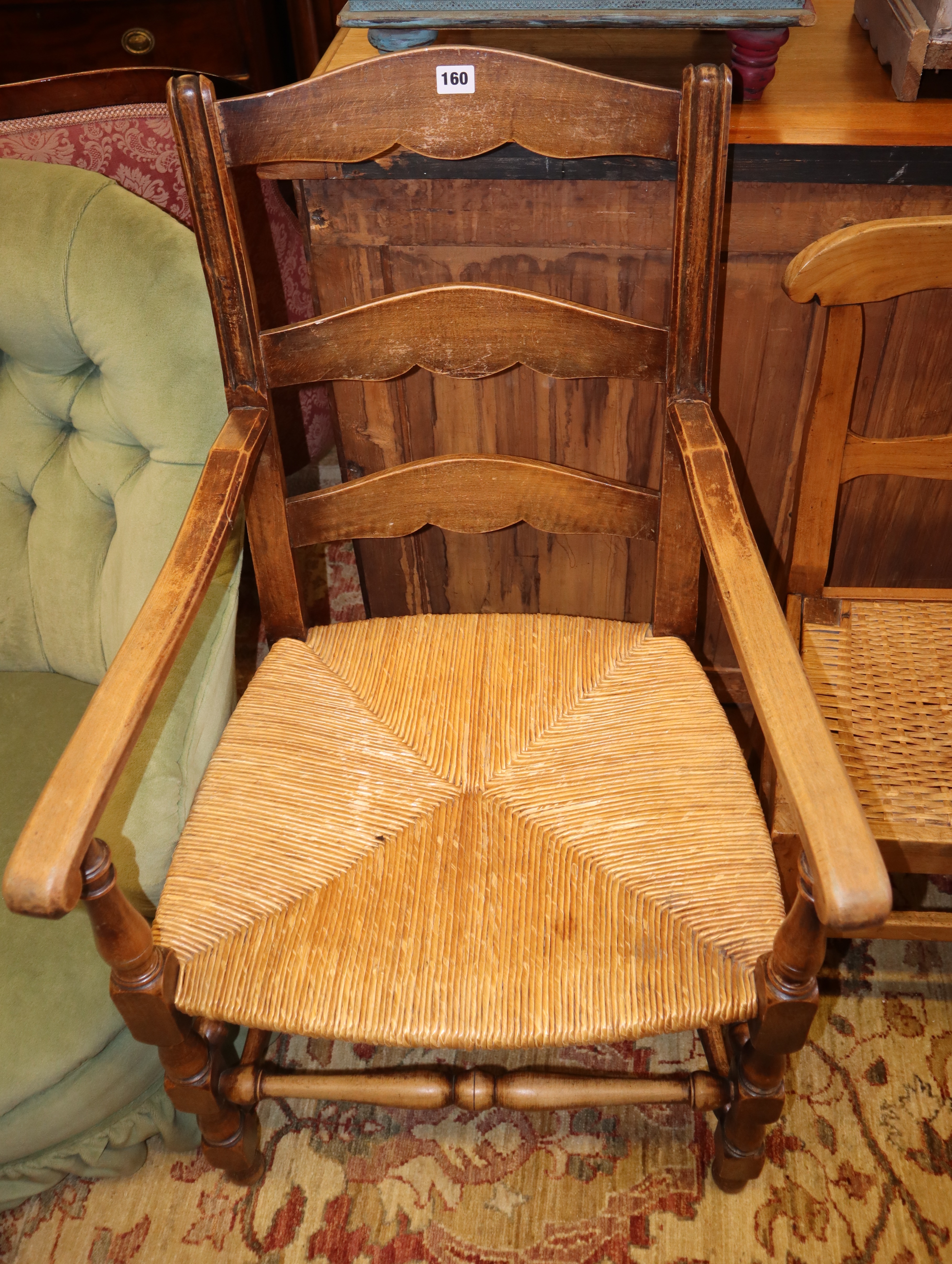 A pair of beech rush seat elbow chairs and a pair of 19th century French fruitwood chairs